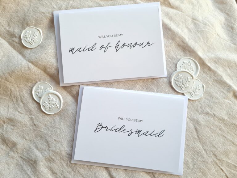 Two greeting cards with elegant calligraphy that read "Will you be my maid of honour" and "Will you be my bridesmaid". The cards have a simple and modern design, with a white background and black text.