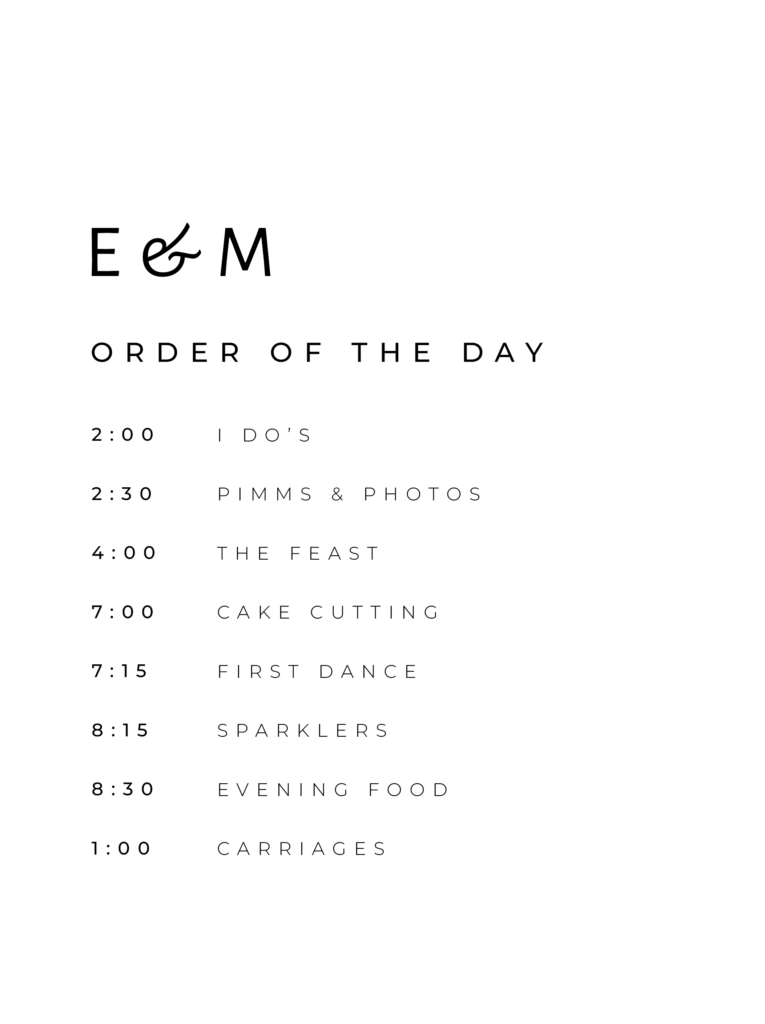 A white wedding order of the day sign with modern black text reading "E and M Order of the Day"